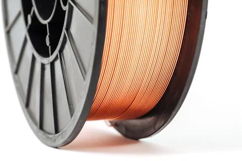 Welding wire spool on a white background Foto stock