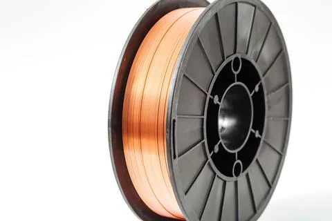 Welding wire spool on a white background Foto stock