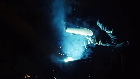 Welding work at construction site in dark in slow motion Video stock 73200204