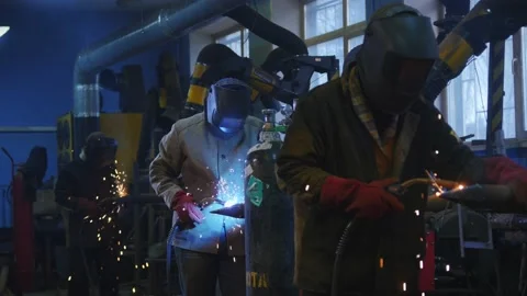 Welding work at the factory. Workers are engaged in gas welding. Factory work. Video stock 218026551