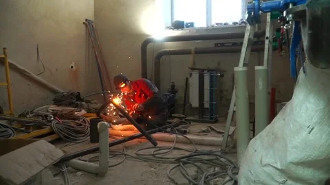 Welding Work, Man Installation Pipe And Welding In Workshop Sparks Metalwork Stock Footage 214407693