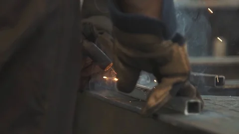 Welding work by a professional factory foreman using modern industrial equipment Stock Footage 125881359