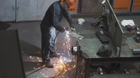 Welding work by a professional factory foreman using modern industrial equipment Stock Footage 125881413