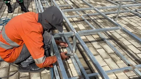 Welding work of thin hollow iron close up Stock Footage 296723961
