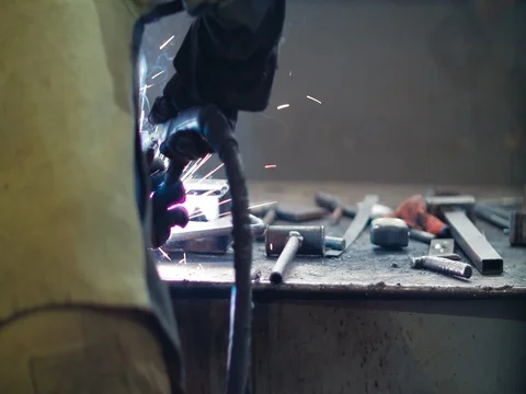 Welding work ; welder welding metal material Stock Footage 78477226