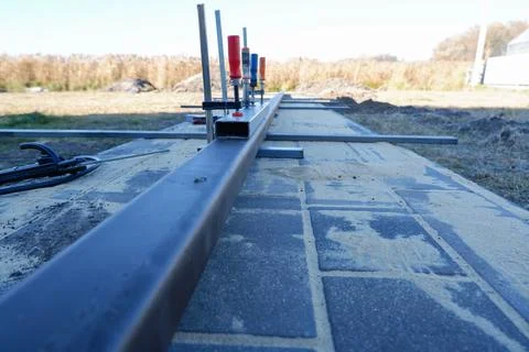 Welding work. Welding of the guide profile of sliding gates. Guide profile fo Stock Photos