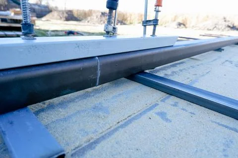 Welding work. Welding of the guide profile of sliding gates. Guide profile fo Stock Photos