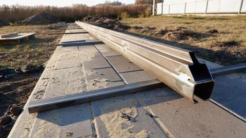 Welding work. Welding of the guide profile of sliding gates. Guide profile fo Stock Photos
