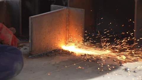 Welding work. A worker welds chains at a factory Stock Footage 285962288