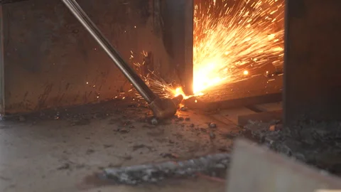Welding work. A worker welds chains at a factory Stock Footage 285962343