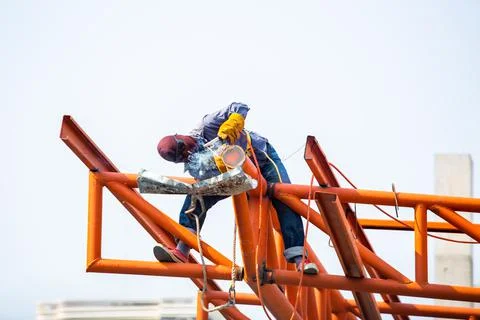 The welding workers at structures site. Worker is welding steel structures. Stock Photos