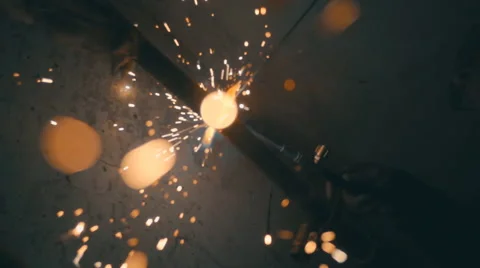 Welding works on a black background and a lot of sparks flying around Stock Footage 64878465