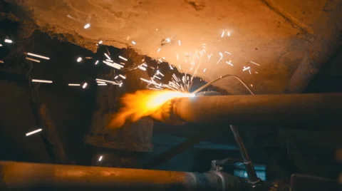 Welding works on a black background and a lot of sparks flying around Stock Footage 64878766