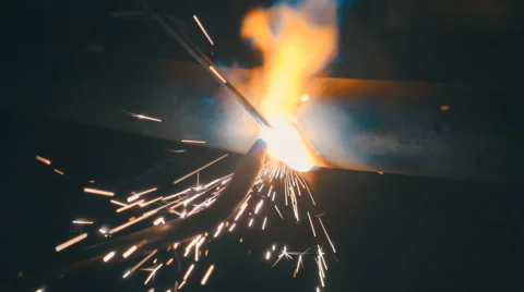 Welding works on a black background and a lot of sparks flying around Stock Footage 64878968