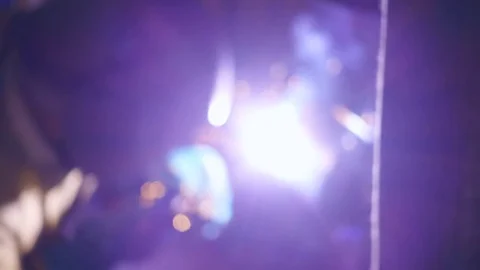 Welding works on a black background and a lot of sparks flying around, in blur Stock Footage 71647609