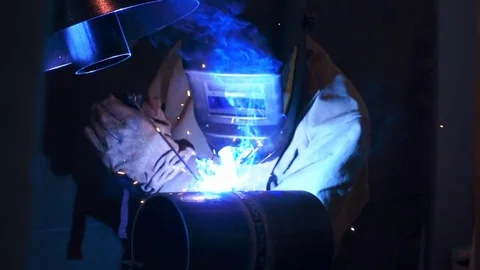 Welding works on a black background and a lot of sparks flying around Stock Footage 71647688
