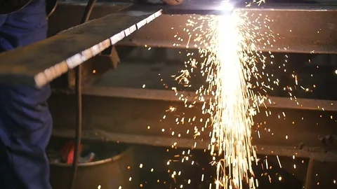 Welding works on a black background and a lot of sparks flying around, in blur Video stock 84829695