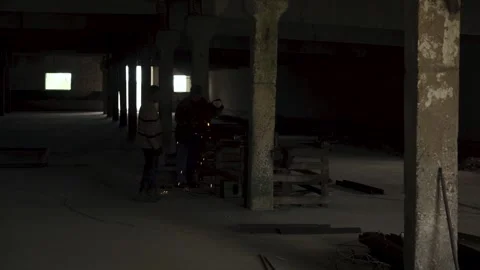 Welding works in an old building. The process of the welder. Stock Footage 248117419