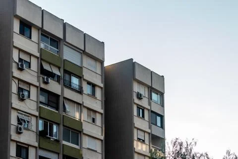 A well angled corner perspective shoot from a building with clear blue sky as Stock Photos