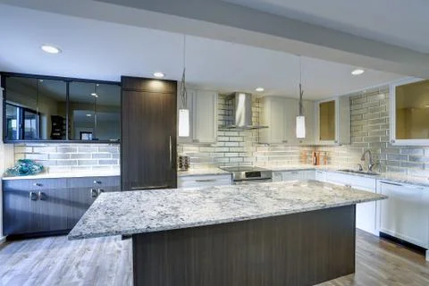 Well appointed kitchen features a large kitchen island, gray quartzite counte Stock Photos