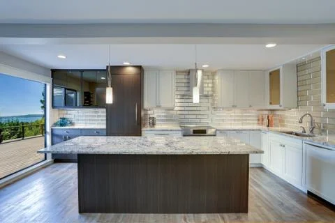 Well appointed kitchen features a large kitchen island, gray quartzite counte Stock Photos