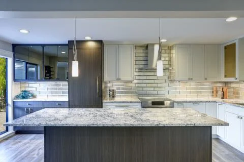 Well appointed kitchen features a large kitchen island, gray quartzite counte Stock Photos