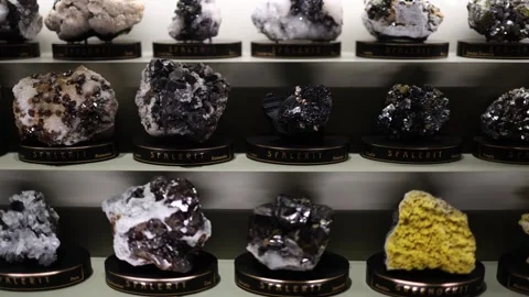 A well-curated museum display of sphalerite and greenockite mineral specimens fr Stock Footage 289635655