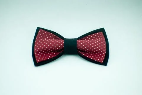 Well-designed stylish black-red bow tie made of soft cloth Stock Photos