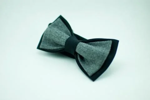 Well-designed stylish dark-grey bow tie made of soft cloth Stock Photos