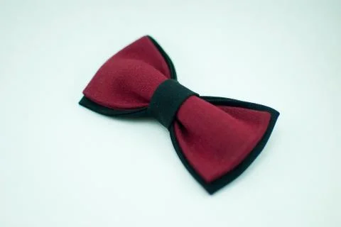 Well-designed stylish red-black bow tie made of soft cloth Stock Photos