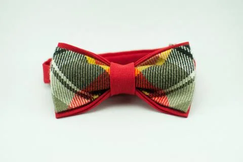 Well-designed stylish red bow tie made of soft cloth Stock Photos