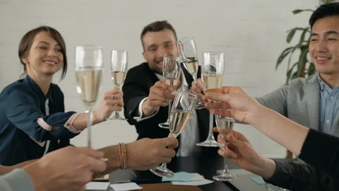 Well done everybody! Top view of young business people toasting each other and Stock Footage 108748069