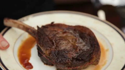 Well done steak on plate Stock Footage 88823397