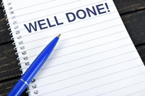 Well Done text on notepad Stock Photos