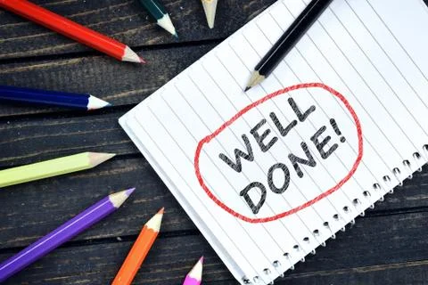 Well Done text on notepad Stock Photos