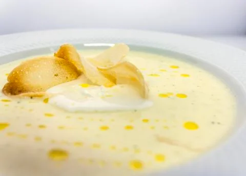 Well-done thin slices of croutons in a creamy soup Stock Photos