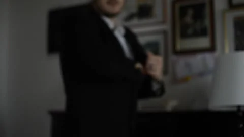 Well-dressed businessman pulls the world out of his jacket Video stock 167682578