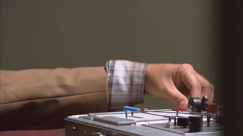 Well-Dressed Man Conducts Polygraph Test HD Video Stock Footage 89875783
