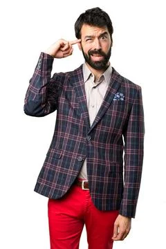 Well dressed man making crazy gesture on white background Stock Photos
