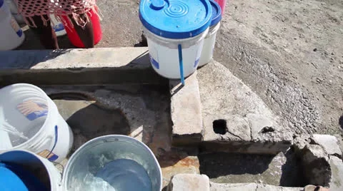 Well filling buckets pan Stock-Footage 26303353