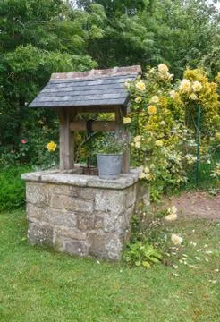 Well in a garden Stock Photos