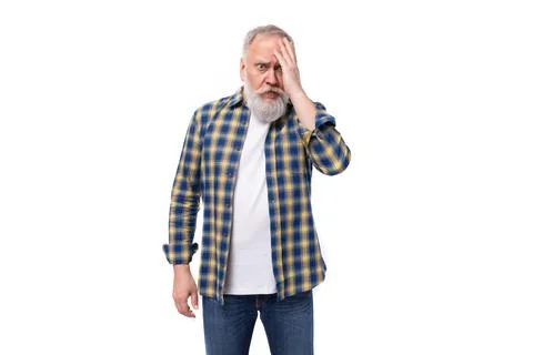 Well-groomed 60s middle-aged gray-haired retired man with a mustache and beard Stock Photos