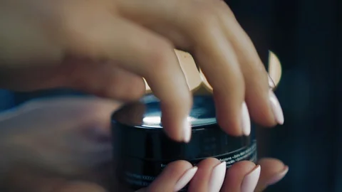 Well-groomed woman's hands open a beauty product and shows it to the camera Stock Footage 86694470