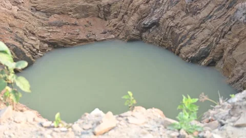 A well that has caved in during the rains. Stock Footage 336307959