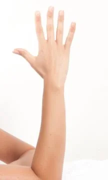 Well-kept woman's hands making gestures or numbers Stock Photos