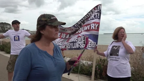 Well known youtuber Based Amy argues with journalists from the BBC in Stock Footage 142773531