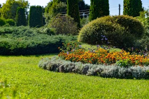 Well-maintained garden, showcasing a harmonious blend of greenery and vibrant Stock Photos