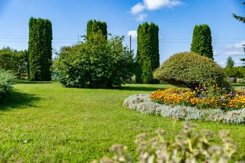 Well-maintained garden, showcasing a harmonious blend of greenery and vibra.. Stock Photos