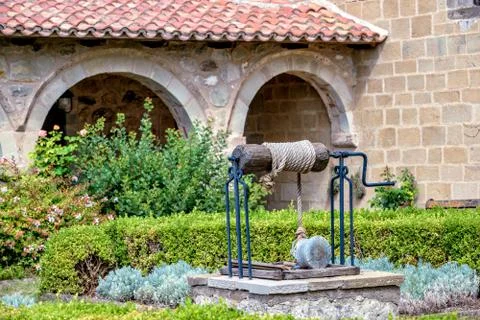 Well in monastery garden Stock Photos