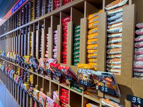 A well-organized retail shelf in a Korean ramen shop, displaying an assortmen Stock Photos